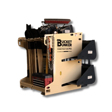 Loaded Construction PRO rack with skid steer buckets, mini-excavator buckets, hand tools, and a toolbox.