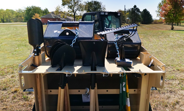 Close view of the Construction PRO top deck holding buckets and crew hand tools.